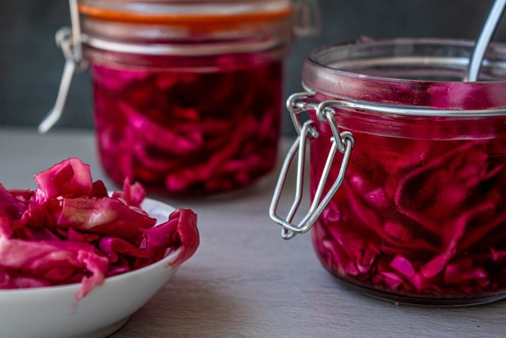 red liquid in clear glass jar